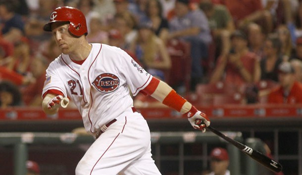 Jul 4, 2015; Cincinnati, OH, USA; Cincinnati Reds third baseman Todd Frazier hits a double in the ninth inning against the Milwaukee Brewers at Great American Ball Park. The Brewers won 7-3. Mandatory Credit: David Kohl-USA TODAY Sports