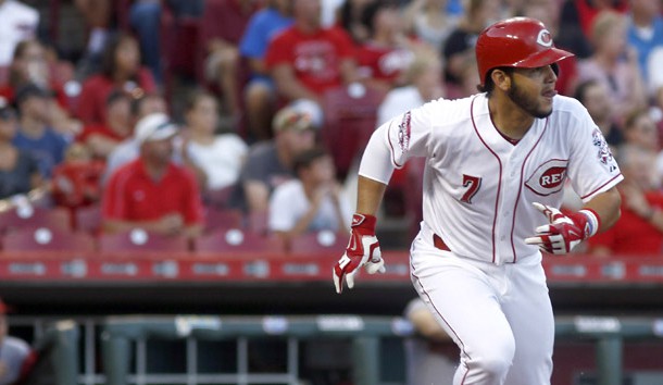 Reds shortstop Eugenio Suarez (7) drives in a run with single in the second inning against the Arizona Diamondbacks at Great American Ball Park. (David Kohl-USA TODAY Sports)