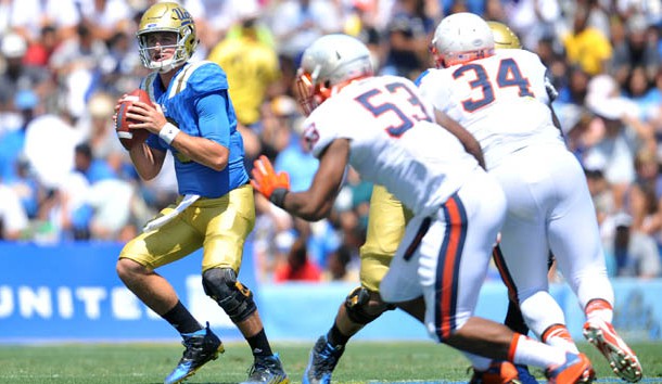 September 5, 2015; Pasadena, CA, USA; UCLA Bruins quarterback Josh Rosen (3) scrambles to pass against the Virginia Cavaliers during the first half at the Rose Bowl. (Gary A. Vasquez-USA TODAY Sports)