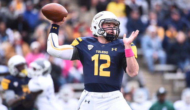 Oct 17, 2015; Toledo, OH, USA; Toledo Rockets quarterback Phillip Ely (12) drops back to pass during the first quarter against the Eastern Michigan Eagles at Glass Bowl. Mandatory Credit: Tim Fuller-USA TODAY Sports