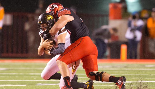 Oct 17, 2015; Salt Lake City, UT, USA; Utah Utes defensive end Hunter Dimick (49) tackles Arizona State Sun Devils quarterback Mike Bercovici (2) during the first half at Rice-Eccles Stadium. Mandatory Credit: Russ Isabella-USA TODAY Sports