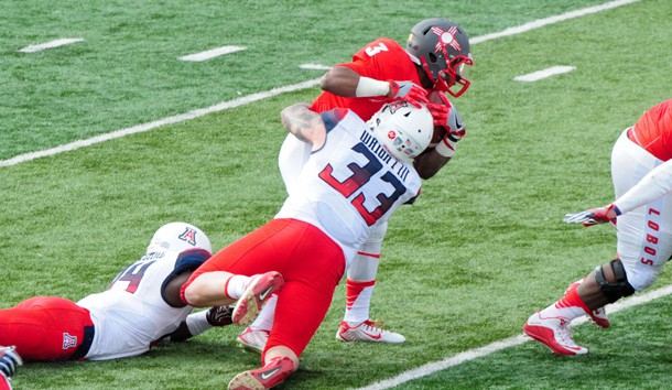 Dec 19, 2015; Albuquerque, NM, USA; Arizona Wildcats linebacker Scooby Wright III (33) tackles New Mexico Lobos running back Richard McQuarley (3) for a loss during the first half in the 2015 New Mexico Bowl at University Stadium. Mandatory Credit: Matt Kartozian-USA TODAY Sports