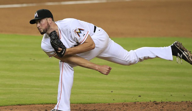 Jun 30, 2015; Miami, FL, USA;  Miami Marlins relief pitcher Carter Capps follows through on a pitch in the seventh inning of a game against the San Francisco Giants at Marlins Park. The Marlins won 5-3. Mandatory Credit: Robert Mayer-USA TODAY Sports