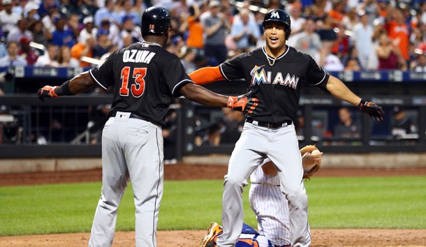 Jul 5, 2016; New York City, NY, USA; Miami Marlins right fielder Giancarlo Stanton (27) and Miami Marlins center fielder Marcell Ozuna (13) celebrate Stanton's two run home run against the New York Mets during the seventh inning at Citi Field. Photo Credit: Brad Penner-USA TODAY Sports