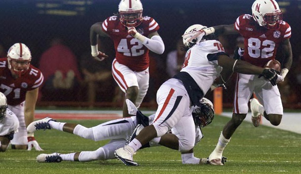 Sep 12, 2015; Lincoln, NE, USA; South Alabama Jaguars defensive lineman Tre Alford (78) tackles Nebraska Cornhuskers wide receiver Alonzo Moore (82) in the second half at Memorial Stadium. Nebraska won 48-9. Photo Credit: Bruce Thorson-USA TODAY Sports