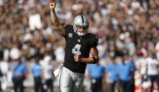 Oct 9, 2016; Oakland, CA, USA; Oakland Raiders quarterback Derek Carr (4) reacts after throwing a touchdown pass against the San Diego Chargers in the third quarter at Oakland Coliseum. The Raiders defeated the Chargers 34-31. Photo Credit: Cary Edmondson-USA TODAY Sports