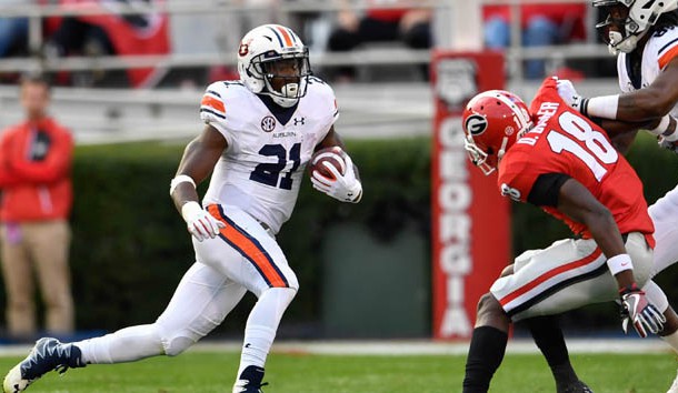 Nov 12, 2016; Athens, GA, USA; Auburn Tigers running back Kerryon Johnson (21) runs past Georgia Bulldogs cornerback Deandre Baker (18) during the second quarter at Sanford Stadium. Photo Credit: Dale Zanine-USA TODAY Sports