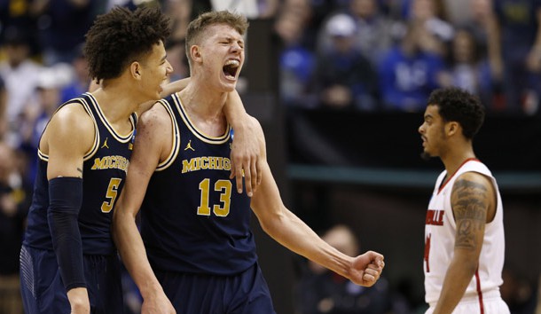 Mar 19, 2017; Indianapolis, IN, USA; Michigan Wolverines forward Moritz Wagner (13) and forward D.J. Wilson (5) celebrate during the second half in the second round of the 2017 NCAA Tournament against the Louisville Cardinals at Bankers Life Fieldhouse. Photo Credit: Brian Spurlock-USA TODAY Sports