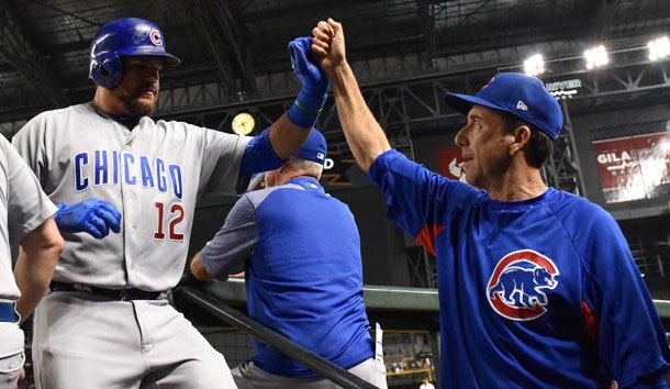 Aug 11, 2017; Phoenix, AZ, USA; Chicago Cubs outfielder Kyle Schwarber (12) is congratulated by catching coach Mike Borzello (58) after hitting a solo home run in the sixth inning against the Arizona Diamondbacks at Chase Field. Photo Credit: Jennifer Stewart-USA TODAY Sports