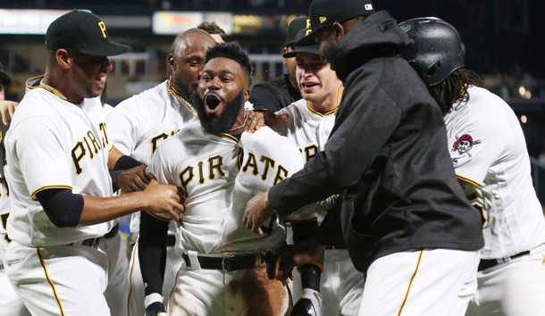 Aug 23, 2017; Pittsburgh, PA, USA;  Pittsburgh Pirates second baseman Josh Harrison (middle) celebrates with teammates after hitting a walk-off home run against the Los Angeles Dodgers during the tenth inning at PNC Park. Harrison's home run was the first Pirate hit of the game off Los Angeles Dodgers pitcher Rich Hill (not Pictured). Photo Credit: Charles LeClaire-USA TODAY Sports