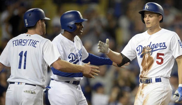 September 26, 2017; Los Angeles, CA, USA; Los Angeles Dodgers shortstop Corey Seager (5) is greeted by second baseman Logan Forsythe (11) and left fielder Curtis Granderson (6) after hitting a three run home run in the seventh inning at Dodger Stadium. Photo Credit: Gary A. Vasquez-USA TODAY Sports