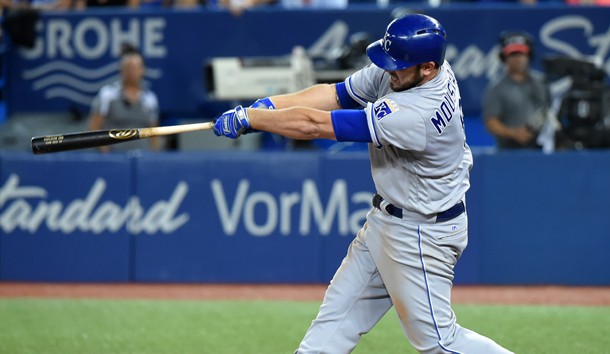 Sep 20, 2017; Toronto, Ontario, CAN; Kansas City Royals third baseman Mike Moustakas (8) hits a home run against the Toronto Blue Jays in the sixth inning at Rogers Centre. Photo Credit: Dan Hamilton-USA TODAY Sports