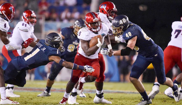 Dec 19, 2017; Boca Raton, FL, USA; Florida Atlantic Owls running back Devin Singletary (5) carries the ball against Akron Zips cornerback Alvin Davis (1) in the 2017 Boca Raton Bowlagainst the Akron Zips  at FAU Stadium. Photo Credit: Steve Mitchell-USA TODAY Sports