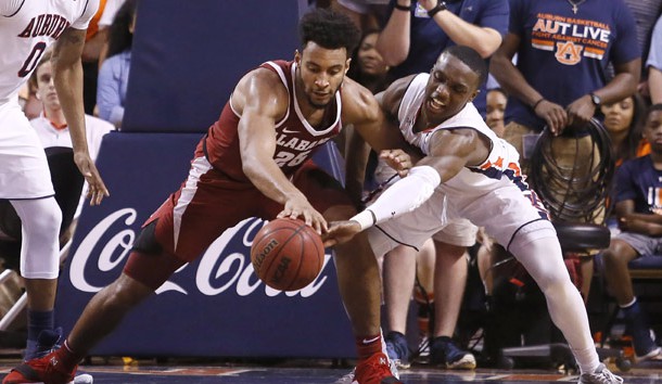 Feb 21, 2018; Auburn, AL, USA; Alabama Crimson Tide forward Braxton Key (25) battles for a loose ball with Auburn Tigers guard Jared Harper (1) during the second half at Auburn Arena.  The Tigers beat the Tide 90-71. Photo Credit: John Reed-USA TODAY Sports