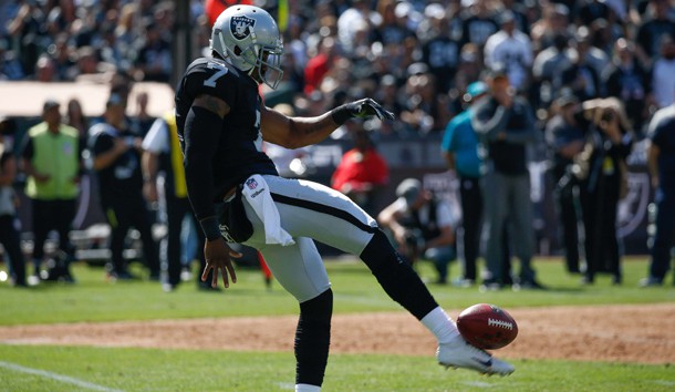 Marquette King (7) punts the ball against the New York Jets during the second quarter at Oakland Coliseum. Photo Credit: Stan Szeto-USA TODAY Sports