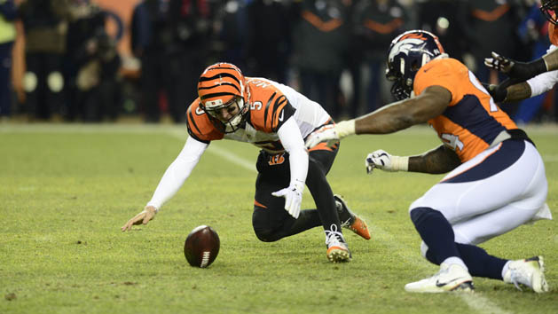 Dec 28, 2015; Denver, CO, USA; Denver Broncos outside linebacker DeMarcus Ware (94) and Cincinnati Bengals quarterback AJ McCarron (5) go after a fumbled football in overtime at Sports Authority Field at Mile High. The Broncos defeated the Cincinnati Bengals 20-17 in overtime. Mandatory Credit: Ron Chenoy-USA TODAY Sports