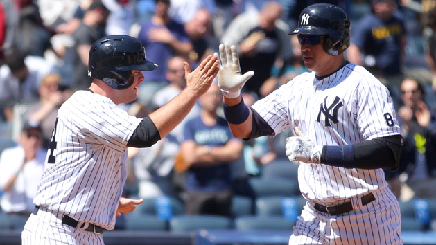 Apr 17, 2016; Bronx, NY, USA; New York Yankees designated hitter Alex Rodriguez (13) high fives catcher Brian McCann (34) after hitting a two run home run against the Seattle Mariners during the second inning at Yankee Stadium. Mandatory Credit: Brad Penner-USA TODAY Sports