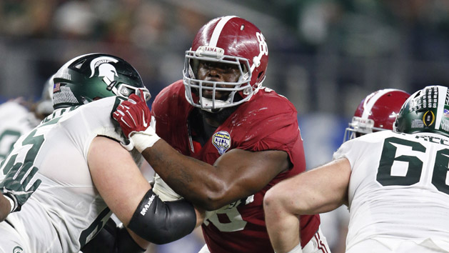 Dec 31, 2015; Arlington, TX, USA; Alabama Crimson Tide defensive tackle A'Shawn Robinson (86) in action in the 2015 CFP semifinal at the Cotton Bowl against Michigan State Spartans guard Brian Allen (65) at AT&T Stadium. Mandatory Credit: Matthew Emmons-USA TODAY Sports