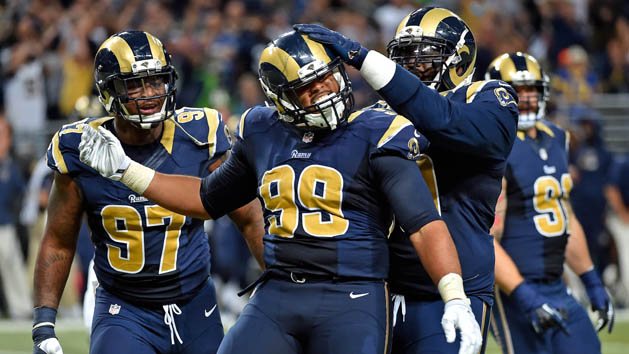 Sep 13, 2015; St. Louis, MO, USA; St. Louis Rams defensive tackle Aaron Donald (99) celebrates with teammates after sacking Seattle Seahawks quarterback Russell Wilson (not pictured) during the second half at the Edward Jones Dome. Mandatory Credit: Jasen Vinlove-USA TODAY Sports