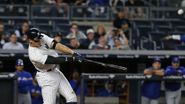 May 2, 2017; Bronx, NY, USA; New York Yankees right fielder Aaron Judge (99) hits a home run against the Toronto Blue Jays in the seventh inning at Yankee Stadium. Photo Credit: Noah K. Murray-USA TODAY Sports
