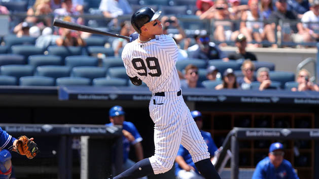 Jul 5, 2017; Bronx, NY, USA; New York Yankees right fielder Aaron Judge (99) follows through on a two run home run against the Toronto Blue Jays during the fourth inning at Yankee Stadium. Photo Credit: Brad Penner-USA TODAY Sports