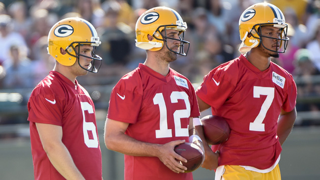 Jan 10, 2016; Landover, MD, USA; Green Bay Packers quarterback Aaron Rodgers (12) throws the ball over Washington Redskins outside linebacker Ryan Kerrigan (91) during the first half in a NFC Wild Card playoff football game at FedEx Field. Mandatory Credit: Geoff Burke-USA TODAY Sports