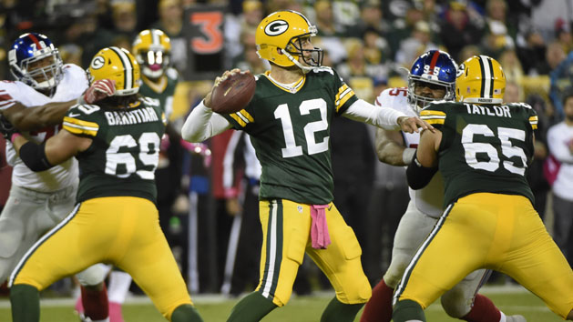 Sep 11, 2016; Jacksonville, FL, USA;Green Bay Packers quarterback Aaron Rodgers (12) runs the ball in for a touchdown as Jacksonville Jaguars cornerback Davon House (31) attempted to defend during the first quarter at EverBank Field. Photo Credit: Kim Klement-USA TODAY Sports
