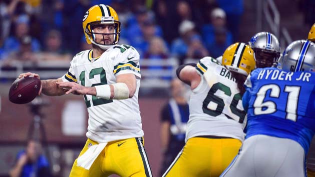 Dec 11, 2016; Green Bay, WI, USA; Green Bay Packers quarterback Aaron Rodgers (12) passes the ball in the first quarter during the game against the Seattle Seahawks at Lambeau Field. Photo Credit: Benny Sieu-USA TODAY Sports