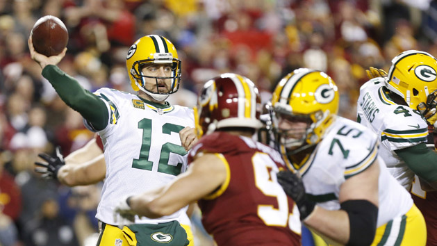 Nov 30, 2014; Green Bay, WI, USA; Green Bay Packers quarterback Aaron Rodgers (12) passes the ball during the second half against the New England Patriots at Lambeau Field. The Packers won 26-21. Mandatory Credit: Chris Humphreys-USA TODAY Sports