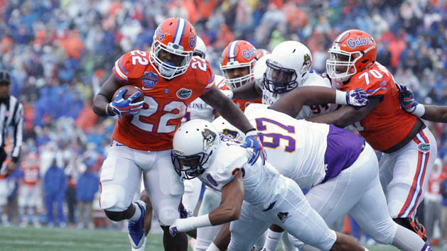 Adam Lane (22) is hit by East Carolina Pirates defensive back Travon Simmons (3) as he scores a touchdown during the Birmingham Bowl at Legion Field. (Marvin Gentry-USA TODAY Sports)