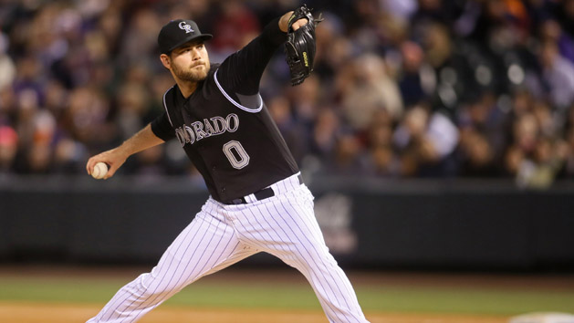 Apr 24, 2015; Denver, CO, USA; Colorado Rockies closer Adam Ottavino (0) delivers a pitch during the ninth inning against the San Francisco Giants at Coors Field. The Rockies won 6-4. Mandatory Credit: Chris Humphreys-USA TODAY Sports