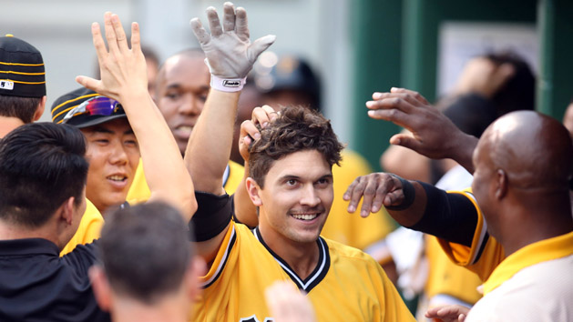 Jul 24, 2016; Pittsburgh, PA, USA; Pittsburgh Pirates pinch hitter Adam Frazier (26) celebrates with teammates in the dugout after hitting a solo home run against the Philadelphia Phillies during the seventh inning at PNC Park. Photo Credit: Charles LeClaire-USA TODAY Sports