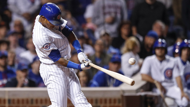 Sep 1, 2016; Chicago, IL, USA; Chicago Cubs shortstop Addison Russell (27) hits two RBI single off San Francisco Giants relief pitcher Cory Gearrin (not pictured) during the seventh inning at Wrigley Field. Photo Credit: Kamil Krzaczynski-USA TODAY Sports