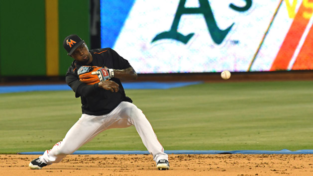 Jun 13, 2017; Miami, FL, USA; Miami Marlins shortstop Adeiny Hechavarria (3) takes infield practice before a game against the Oakland Athletics at Marlins Park. Photo Credit: Steve Mitchell-USA TODAY Sports