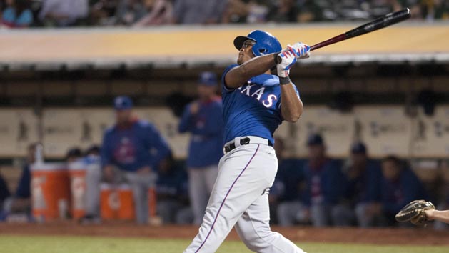 Sep 23, 2015; Oakland, CA, USA; Texas Rangers third baseman Adrian Beltre (29) hits a home run against the Oakland Athletics during the fifth inning at O.co Coliseum. Mandatory Credit: Ed Szczepanski-USA TODAY Sports
