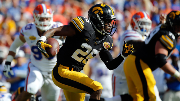 Jan 2, 2017; Tampa , FL, USA; Iowa Hawkeyes running back Akrum Wadley (25) runs with the ball against the Florida Gators during the second quarter at Raymond James Stadium. Photo Credit: Kim Klement-USA TODAY Sports