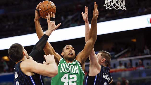 Mar 16, 2018; Orlando, FL, USA; Boston Celtics forward Al Horford (42) shoots between Orlando Magic forward Mario Hezonja (8) and center Nikola Vucevic (9) during the first quarter at Amway Center. Photo Credit: Reinhold Matay-USA TODAY Sports