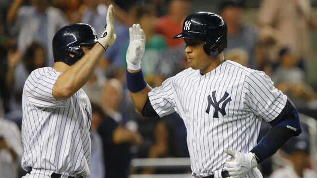 Jul 22, 2015; Bronx, NY, USA; New York Yankees designated hitter Alex Rodriguez (13) celebrates with first baseman Mark Teixeira (25) after hitting a home run against the Baltimore Orioles in the fifth inning at Yankee Stadium. Mandatory Credit: Noah K. Murray-USA TODAY Sports
