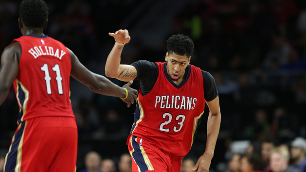 Feb 21, 2016; Auburn Hills, MI, USA; New Orleans Pelicans forward Anthony Davis (23) celebrates with teammate guard Jrue Holiday (11) after making a three point shot during the fourth quarter. Davis scored 59 point at The Palace of Auburn Hills. The Pelicans defeated the Pistons 111-106. Mandatory Credit: Leon Halip-USA TODAY Sports