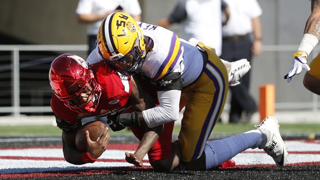 Dec 31, 2016; Orlando, FL, USA; Louisville Cardinals quarterback Lamar Jackson (8) is sacked for a safety by LSU Tigers defensive end Arden Key (49) during the first half at Camping World Stadium. Photo Credit: Kim Klement-USA TODAY Sports