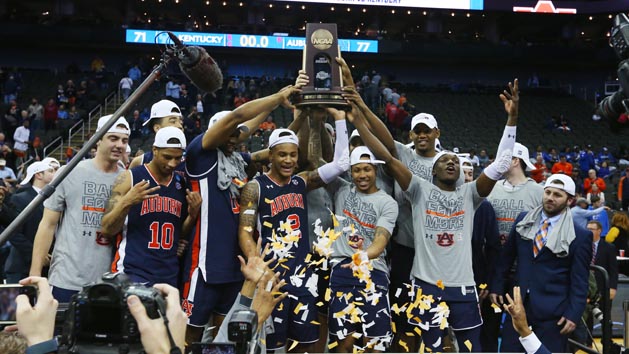 Mar 31, 2019; Kansas City, MO, United States; Auburn Tigers players celebrate with the trophy after defeating the Kentucky Wildcats in the championship game of the midwest regional of the 2019 NCAA Tournament at Sprint Center. Photo Credit: Jay Biggerstaff-USA TODAY Sports
