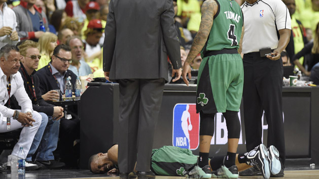 Apr 16, 2016; Atlanta, GA, USA; Boston Celtics guard Avery Bradley (0) lays on the court after an injury against the Atlanta Hawks during the second half in game one of the first round of the NBA Playoffs at Philips Arena. Photo Credit: John David Mercer-USA TODAY Sports
