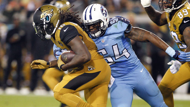 Nov 19, 2015; Jacksonville, FL, USA; Jacksonville Jaguars running back Denard Robinson (16) runs for a first down past Tennessee Titans inside linebacker Avery Williamson (54) during the second quarter of a football game at EverBank Field. Mandatory Credit: Reinhold Matay-USA TODAY Sports