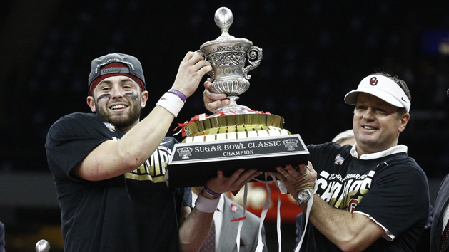 Jan 2, 2017; New Orleans , LA, USA; Oklahoma Sooners quarterback Baker Mayfield (middle) lifts the champions trophy with Sooners head coach Bob Stoops after defeating the Auburn Tigers in the 2017 Sugar Bowl at the Mercedes-Benz Superdome. Oklahoma won 35-19. Photo Credit: Derick E. Hingle-USA TODAY Sports
