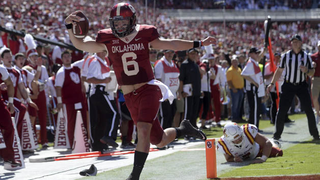 Oct 7, 2017; Norman, OK, USA; Oklahoma Sooners quarterback Baker Mayfield (6) scores a touchdown in front of Iowa State Cyclones linebacker Joel Lanning (7) during the second quarter at Gaylord Family - Oklahoma Memorial Stadium. Photo Credit: Mark D. Smith-USA TODAY Sports