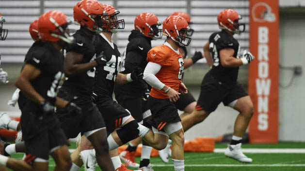 May 4, 2018; Berea, OH, USA; Cleveland Browns rookies run through warm ups, including quarterback Baker Mayfield (orange jersey) during rookie minicamp at the Cleveland Browns training facility. Photo Credit: Ken Blaze-USA TODAY Sports