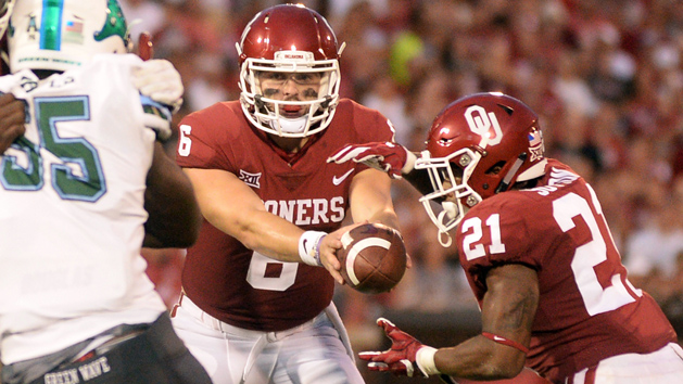 Sep 16, 2017; Norman, OK, USA; Oklahoma Sooners quarterback Baker Mayfield (6) hands off the ball to Oklahoma Sooners running back Marcelias Sutton (21) to score a touchdown against the Tulane Green Wave during the third quarter at Gaylord Family - Oklahoma Memorial Stadium. Photo Credit: Mark D. Smith-USA TODAY Sports