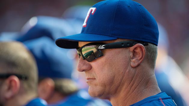 Oct 4, 2015; Arlington, TX, USA; Texas Rangers manager Jeff Banister (28) looks on from the dugout against the Los Angeles Angels at Globe Life Park in Arlington. The Rangers won 9-2 and clinch the American League West division. Mandatory Credit: Jerome Miron-USA TODAY Sports
