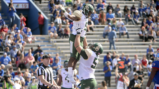 Oct 10, 2015; Lawrence, KS, USA; Baylor Bears running back Johnny Jefferson (5) celebrates with offensive tackle Spencer Drango (58) after scoring a touchdown against the Kansas Jayhawks in the first half at Memorial Stadium. Mandatory Credit: John Rieger-USA TODAY Sports