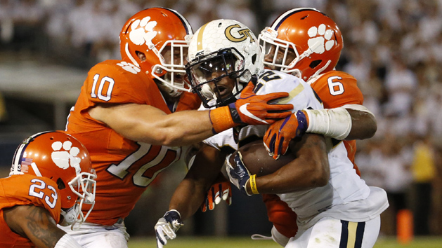 Sep 22, 2016; Atlanta, GA, USA; Georgia Tech Yellow Jackets running back Clinton Lynch (22) gets tackled by Clemson Tigers linebacker Ben Boulware (10) and linebacker Dorian O'Daniel (6) in the third quarter of their game at Bobby Dodd Stadium. The Tigers won 26-7. Photo Credit: Jason Getz-USA TODAY Sports